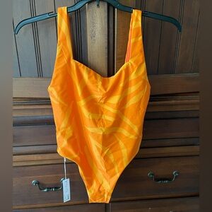 Jolyn swimsuit.  Size Lg.  Beautiful sunrise colors of oranges and yellows.